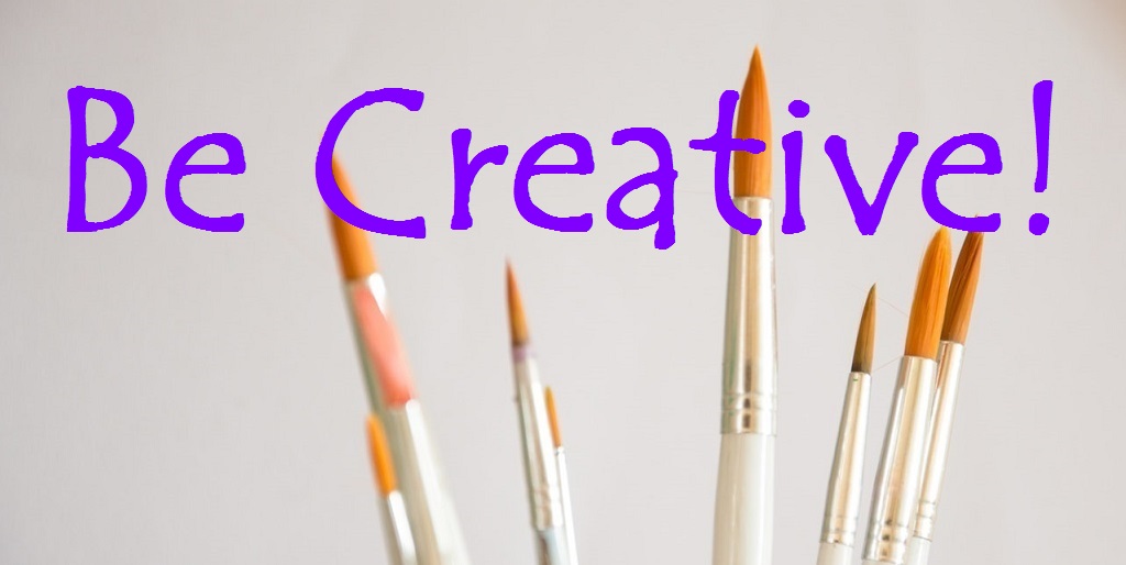 Photo of paintbrushes with 'Be creative' written over it. 