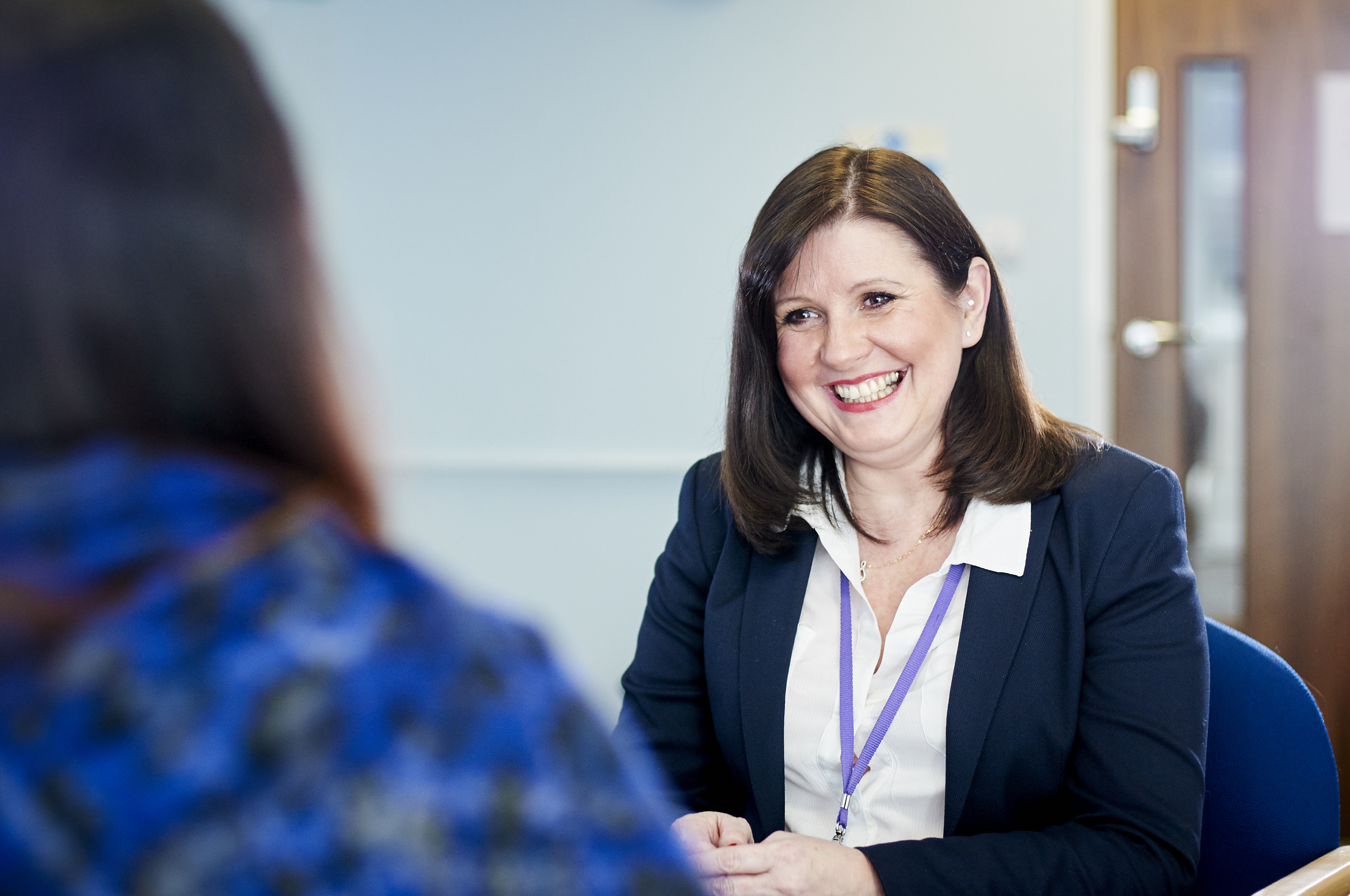 Photo of member of the ISVA team with a large smile on her face