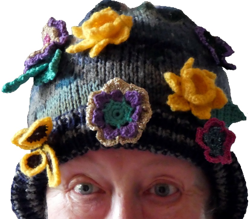 Flowers and butterfly motifs adorn a hat - made by one of the crafters